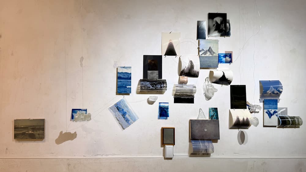 Solo Exhibition MNEMOSIS Installation Wall I — Photo prints, encaustic with natural pigment (malachite), chemigrams, lumen prints, Collodio-chloride prints on metal, cyanotypes on fabric and glass, glass sculptures, negatives — Jay Lee